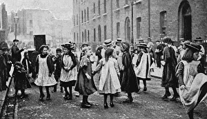 Prints of Girls in a London street dance to the music of a barrel organ Date: circa 1900 Dance Prints: London Street Dance Print, circa 1900