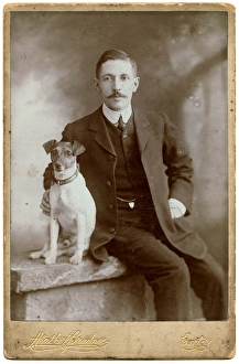 Studio portrait, man with Jack Russell terrier dog Studio portrait, man with Jack Russell terrier dog