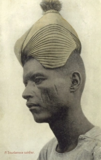 Sudanese soldier with remarkable hat Sudanese soldier with remarkable hat