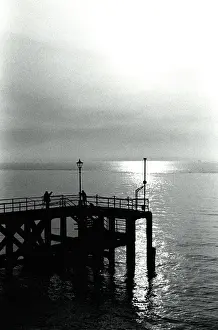 Atmospheric Sunset Image Prints: Sunset over a pier