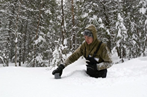 Taking a snow depth measurement - boreal forest Taking a snow depth measurement - boreal forest