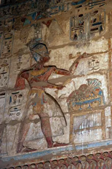 Temple of Ramses III. The pharaoh Ramses III, who wears the Temple of Ramses III. The pharaoh Ramses III, who wears the