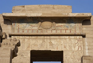Temple of Ramses III. Winged sun relief as a symbol of prote Temple of Ramses III. Winged sun relief as a symbol of prote