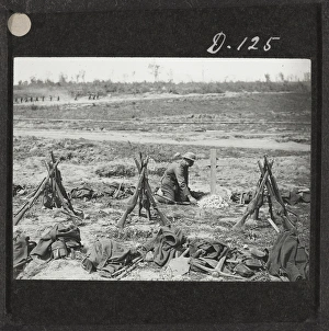 Tending a grave near Mametz Wood, August 1916 Tending a grave near Mametz Wood, August 1916