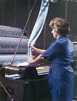 Textile Manufacturing Process Prints: Threads entering a weaving machine