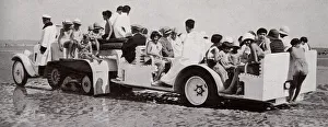 The tractor coach at Deauville takes children down to beach The tractor coach at Deauville takes children down to beach