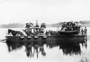 Prints of Two sight-seeing excursion coaches are carried by steam ferry across Lake Windermere, in the heart of Englands Lake District Lake Prints: Crossing Windermere Print: Steam Ferry on Lake Windermere