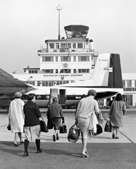 Travellers at Jersey Airport, Channel Islands Travellers at Jersey Airport, Channel Islands
