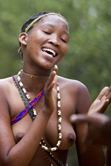 Tribal Dancer - Bushmen Girl dancing in Manghetti dunes Tribal Dancer - Bushmen Girl dancing in Manghetti dunes