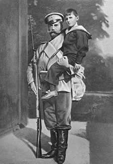 Tsar Nicholas II holding his son, the Tsarevich Alexei Tsar Nicholas II holding his son, the Tsarevich Alexei