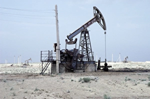 A typical oil-pump - oil-well in a desert A typical oil-pump - oil-well in a desert