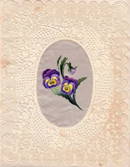 Variegated flowers on a paper lace greetings card Variegated flowers on a paper lace greetings card