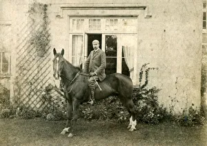 Victorian country gentleman on horse in front of house Victorian country gentleman on horse in front of house