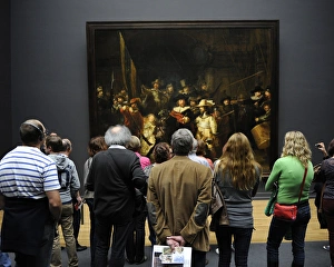 Visitors looking at The Night Watch by Rembrandt (1606-1669) Visitors looking at The Night Watch by Rembrandt (1606-1669)