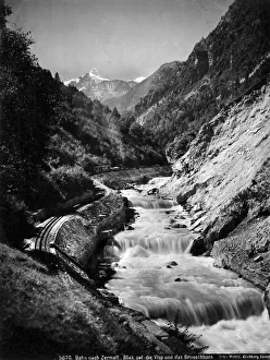 The Visp-Zermatt Railway Line by River Rhone, Switzerland The Visp-Zermatt Railway Line by River Rhone, Switzerland