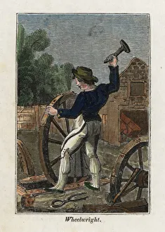 Wheelwright hammering a metal cover onto a Wheelwright hammering a metal cover onto a