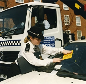 Woman police officer in a London street Woman police officer in a London street