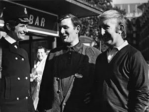Woman police officer with two men on a London street Woman police officer with two men on a London street