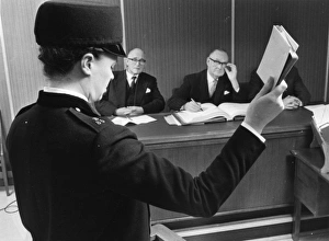 Woman police officer taking oath in court, London Woman police officer taking oath in court, London