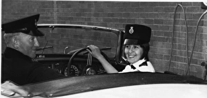 Woman police officer at the wheel of a car, London Woman police officer at the wheel of a car, London