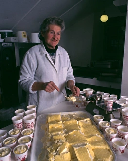 Woman serving Roskillys Cornish Clotted Cream Woman serving Roskillys Cornish Clotted Cream