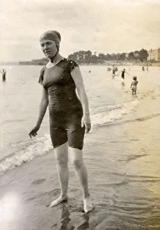 Woman in a swimming costume on the beach at the seaside Woman in a swimming costume on the beach at the seaside