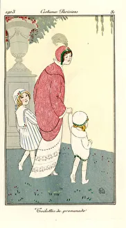 Woman in walking dress with children in a park Woman in walking dress with children in a park