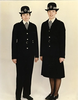 Two women police officers in new bowler hat, London Two women police officers in new bowler hat, London