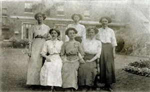 Five women pose for a group photograph in the garden Five women pose for a group photograph in the garden