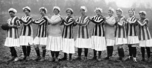 Prints of The team of munitions night workers taking the field for a football match against the day shift women, in the London district. Date: 1917 Sport Prints: Women's War Workers Football Match Print, London 1917