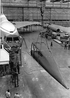 Workmen begin the job of dismantling the Boeing mock-up Workmen begin the job of dismantling the Boeing mock-up