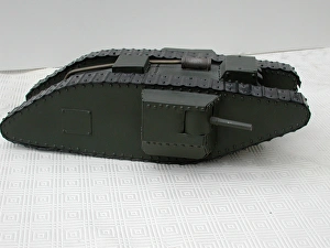WW1 tank painted green with black track WW1 tank painted green with black track