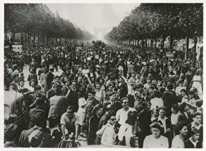 WW2 - An enthusiastic crowd of celebrating Parisians fill the Champs Elysees until dawn WW2 - An enthusiastic crowd of celebrating Parisians fill the Champs Elysees until dawn