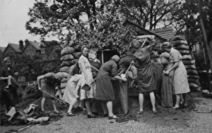 WW2 - Women filling sandbags strengthening the Chalet WW2 - Women filling sandbags strengthening the Chalet