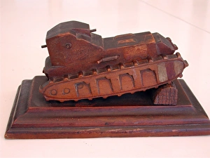 WWI model of a British Whippet tank on a wooden base WWI model of a British Whippet tank on a wooden base