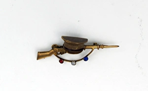 WWI Sweetheart brooch in the form of a rifle and cap WWI Sweetheart brooch in the form of a rifle and cap