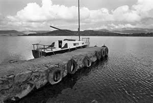 A yacht tied up to a pier on Bala Lake, Gwynedd. North Wales A yacht tied up to a pier on Bala Lake, Gwynedd. North Wales