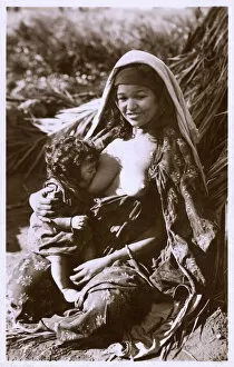 Related Images Collection: Young Algerian Mother breastfeeding her infant
