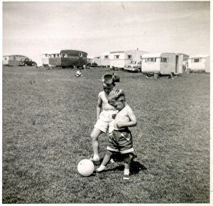 Young brothers playing with ball at a holiday camp Young brothers playing with ball at a holiday camp