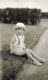 Young child in sunhat and sandals - Margate, Kent Young child in sunhat and sandals - Margate, Kent