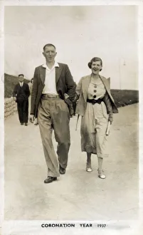 Young couple strolling along the seafront at Bridlington Young couple strolling along the seafront at Bridlington