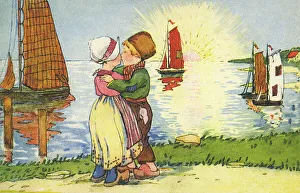 Young Dutch boy and girl share a kiss at sunset Young Dutch boy and girl share a kiss at sunset