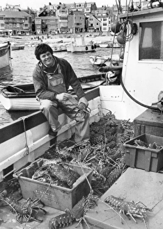 Young fisherman with crawfish, St Ives, Cornwall Young fisherman with crawfish, St Ives, Cornwall