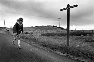 Young girl rollerskating past Sirhowy Valley Walk sign Young girl rollerskating past Sirhowy Valley Walk sign