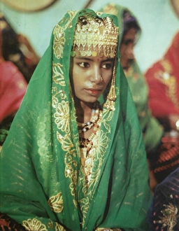 Young girl in traditional Omani dress in Oman Young girl in traditional Omani dress in Oman