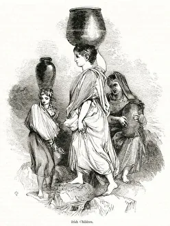 Young Irish women carrying water jars, County Cork Young Irish women carrying water jars, County Cork