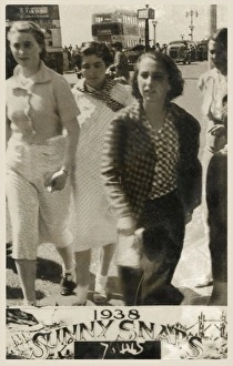 Four young women at the British seaside - walking past Four young women at the British seaside - walking past