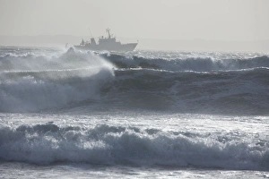 Boat out in stormy sea, Brittany, France Boat out in stormy sea, Brittany, France