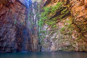 Emma Gorge Waterfall - water plunges down a steep cliff into a picturesque plunge pool in Emma Gorge which is located Emma Gorge Waterfall - water plunges down a steep cliff into a picturesque plunge pool in Emma Gorge which is located