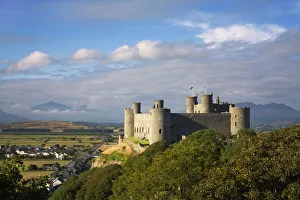 Harlech Castle - over looking Harlech village with Snowdon showing through the clouds in Harlech Castle - over looking Harlech village with Snowdon showing through the clouds in